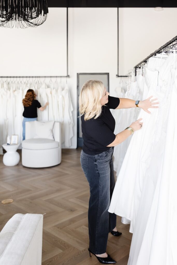 Bride considering wedding dress prices at Asher Lane Bridal, a bridal boutique near Dallas